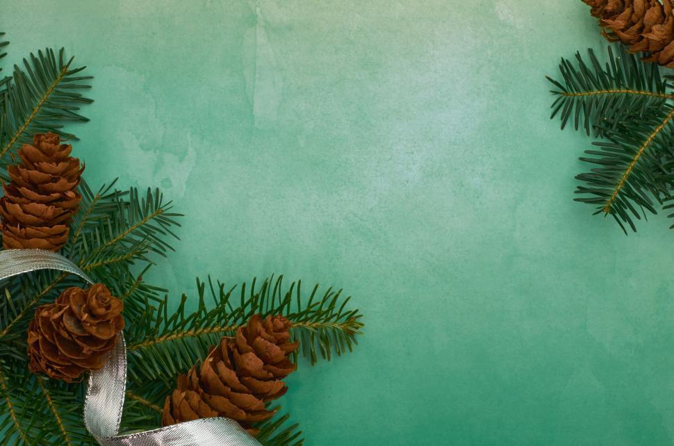 Free Image of Green and brown festive background with ribbon 