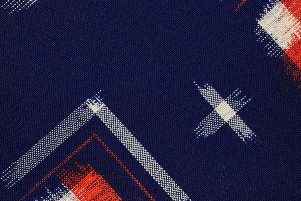 Free Image of Close-up of complex blue and red patterned fabric. 