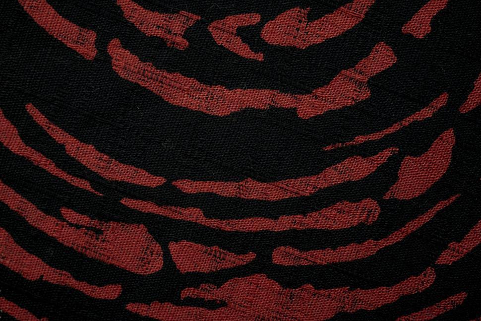 Free Image of Red and black abstract pattern with rough brush strokes 