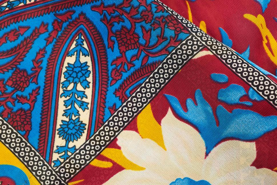 Free Image of Colorful traditional textile with floral patterns close-up 
