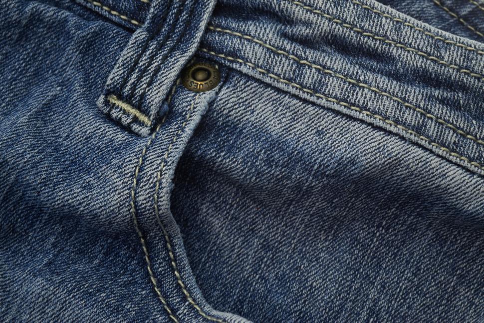 Free Image of Close-up image of blue jeans details showcasing the texture 