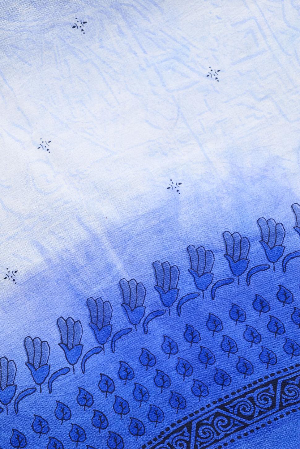 Free Image of Blue and white fabric with intricate patterns and design. 