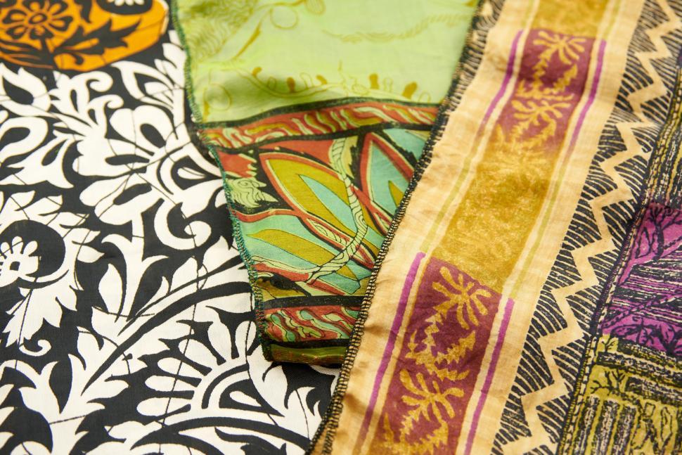 Free Image of Various colorful fabrics with different intricate patterns. 