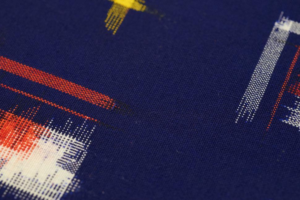 Free Image of Blue fabric with colorful abstract digital art design. 