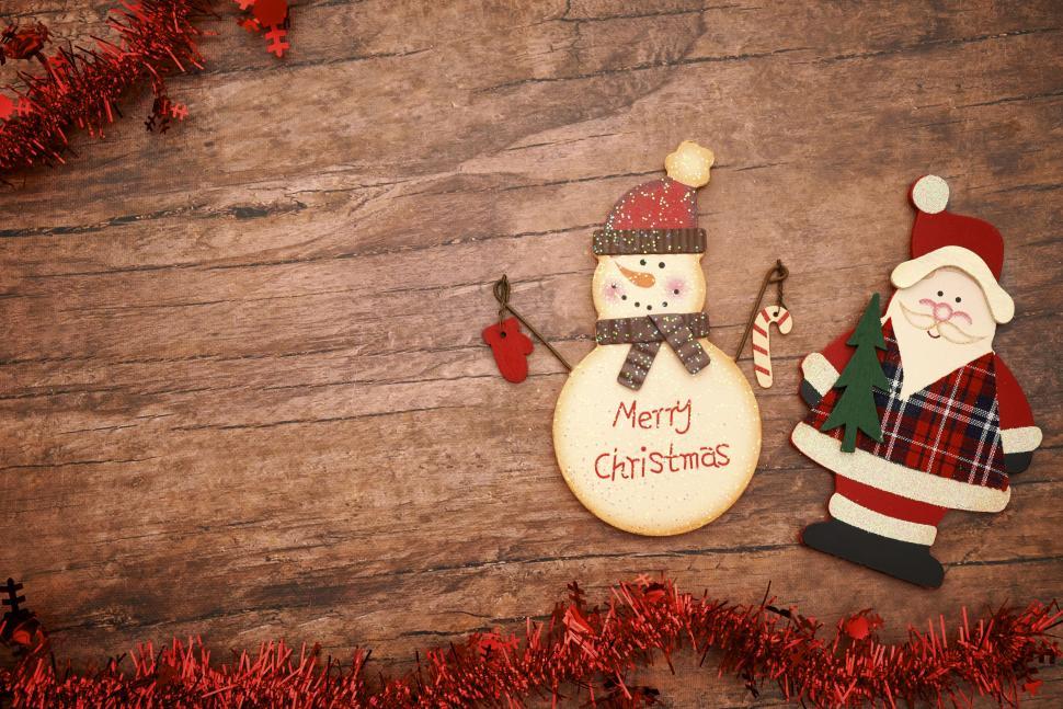 Free Image of Christmas themed background with Santa and snowman. 