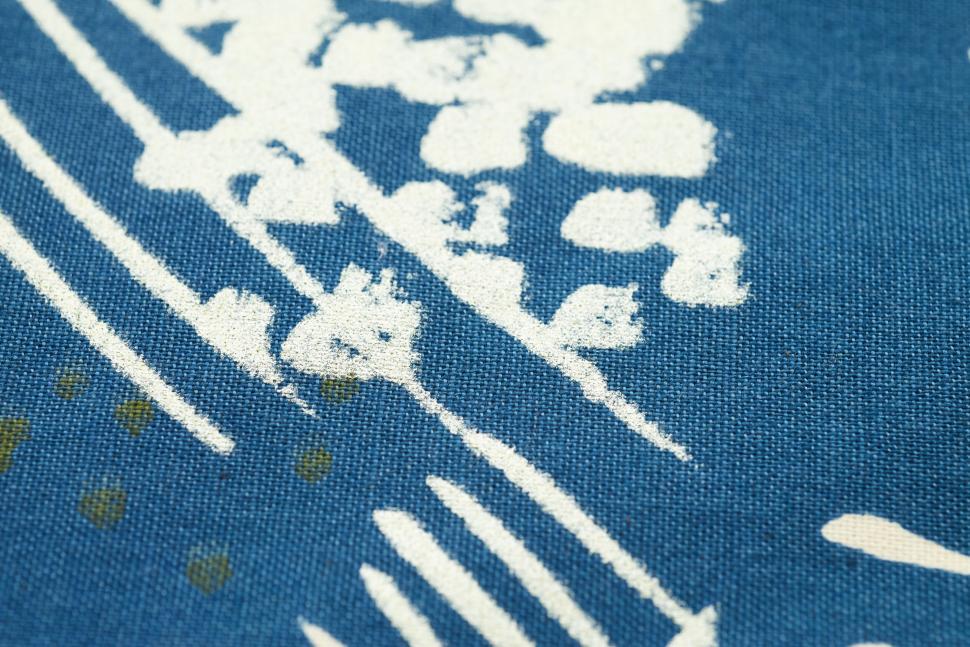 Free Image of Abstract white patterns on blue fabric background. 