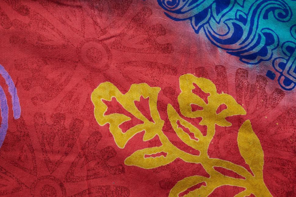Free Image of Colorful batik fabric with floral and geometric patterns 