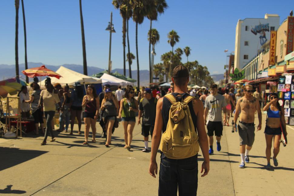 Free Image of Crowded beachside market with various tents and stands. 