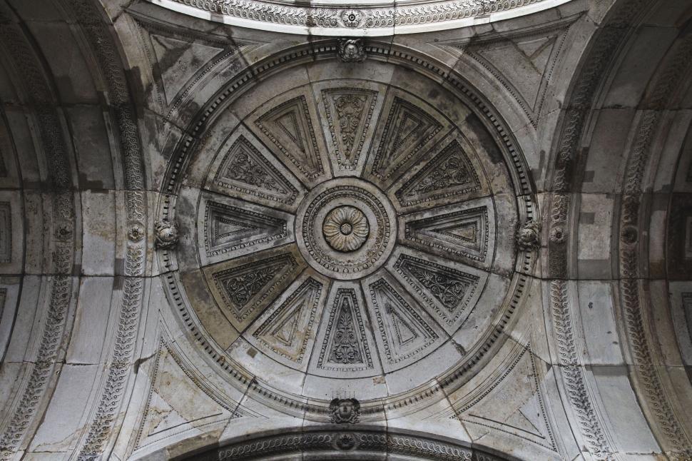 Free Image of Ornate architectural dome with intricate carvings inside 