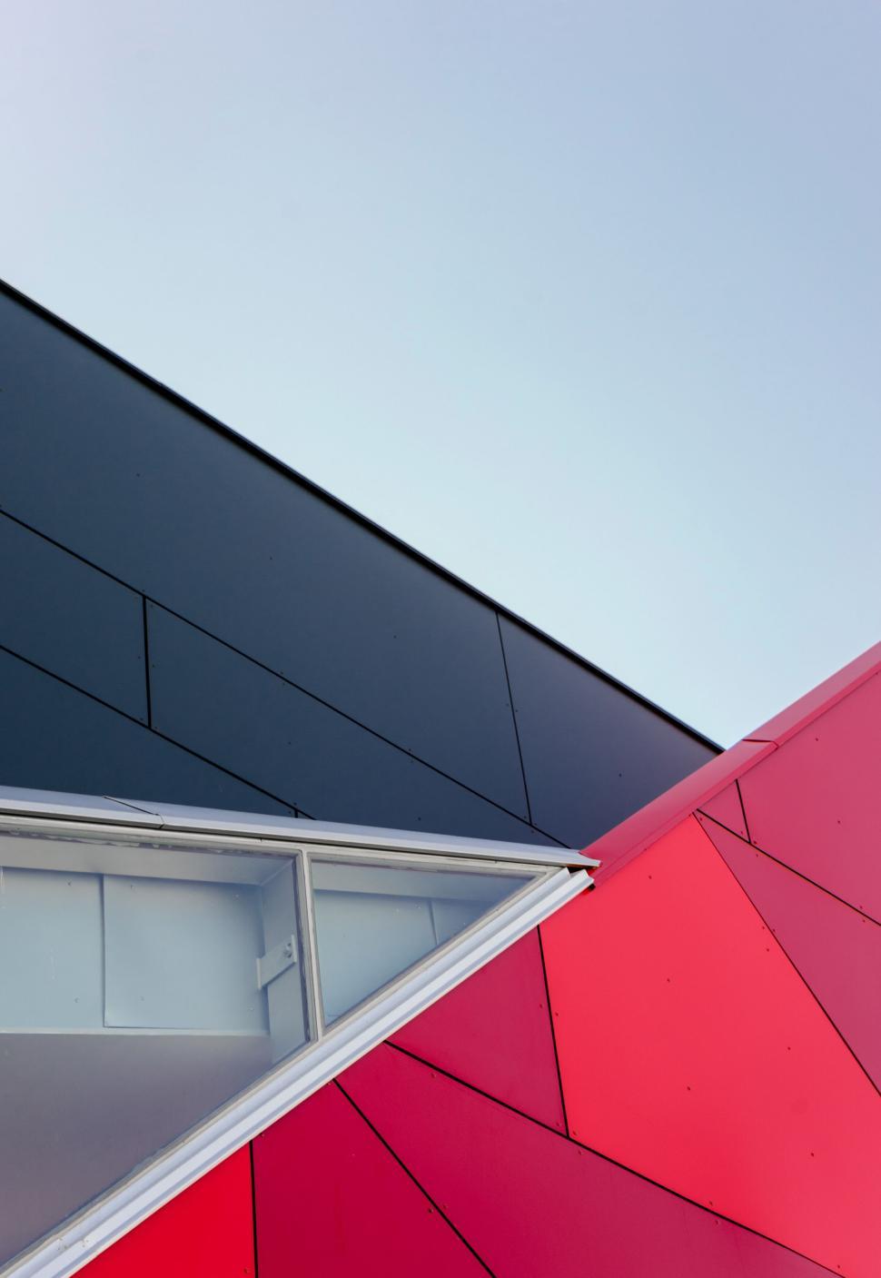 Free Image of Modern architectural building with red and black designs 