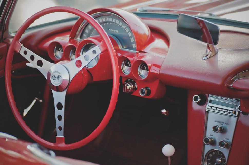 Free Image of Vintage red car interior with steering wheel 