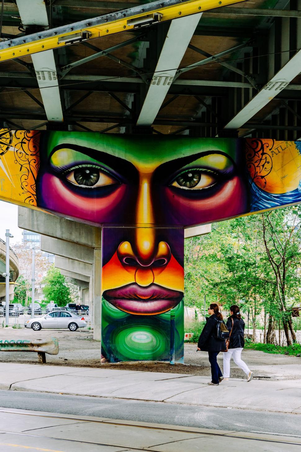 Free Image of Colorful artistic mural painted under urban overpass 