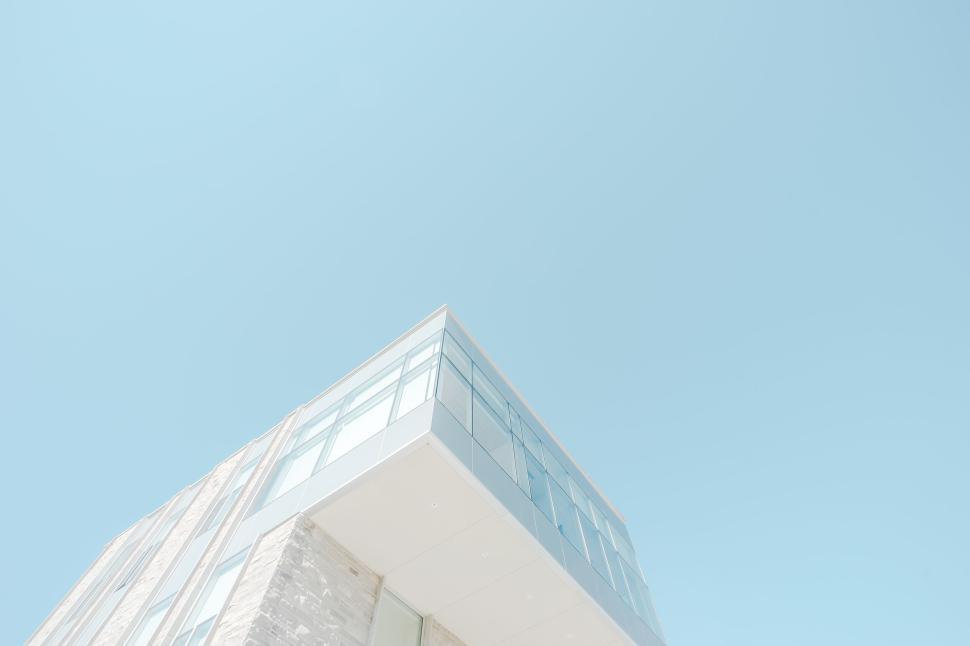 Free Image of Modern glass building corner shot with clear sky 