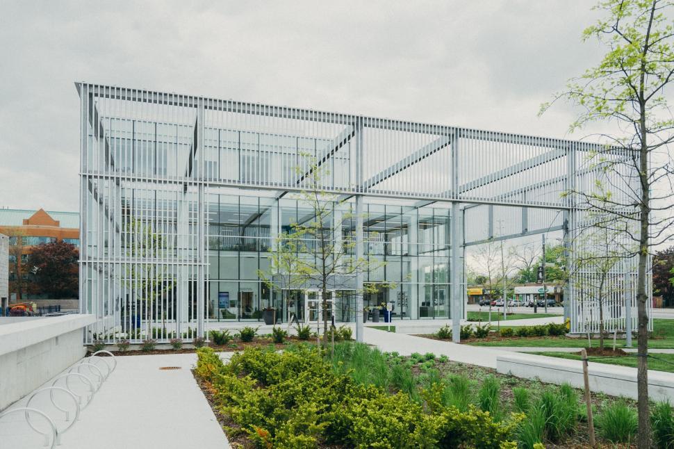 Free Image of Modern glass structure with garden and open spaces. 