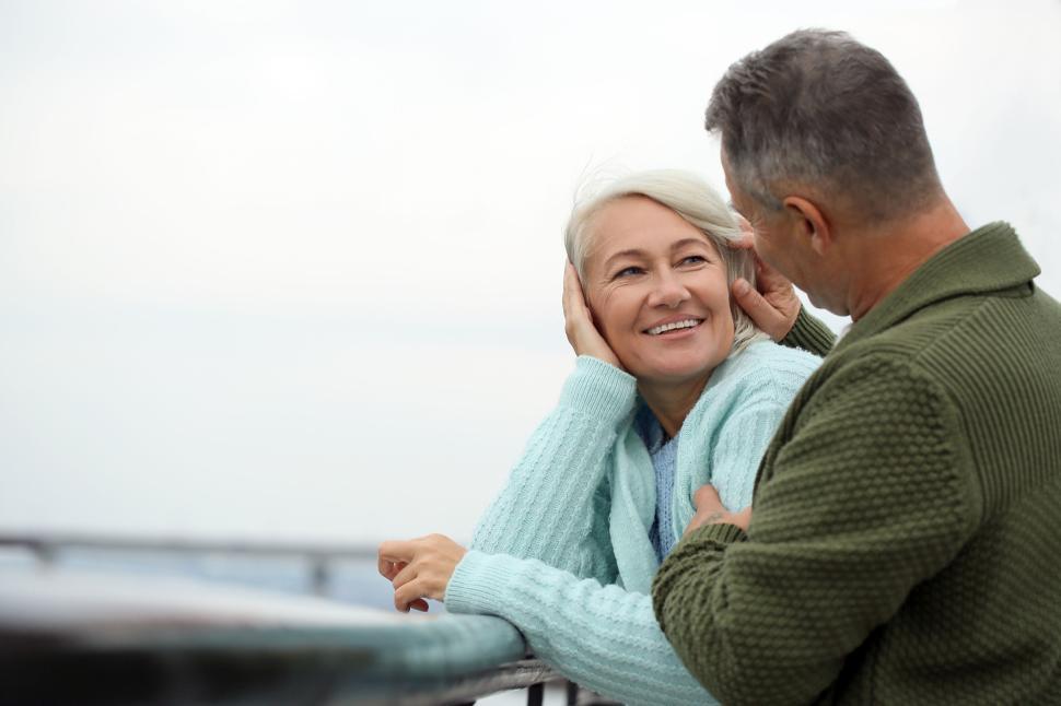 Free Image of Elderly couple enjoying an outdoor moment together. 