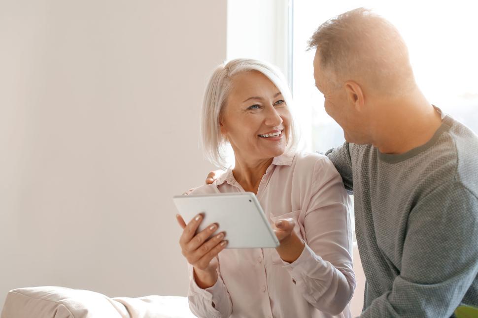 Free Image of Elderly couple enjoying digital photography together 