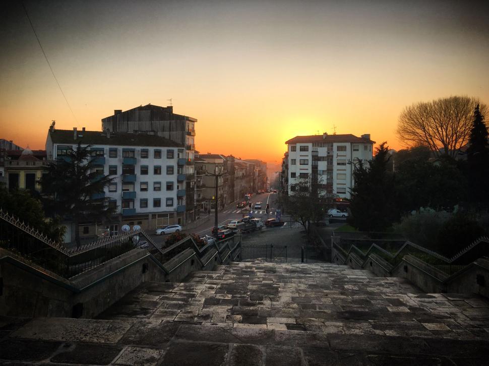 Free Image of Sunset cityscape with modern buildings and street 