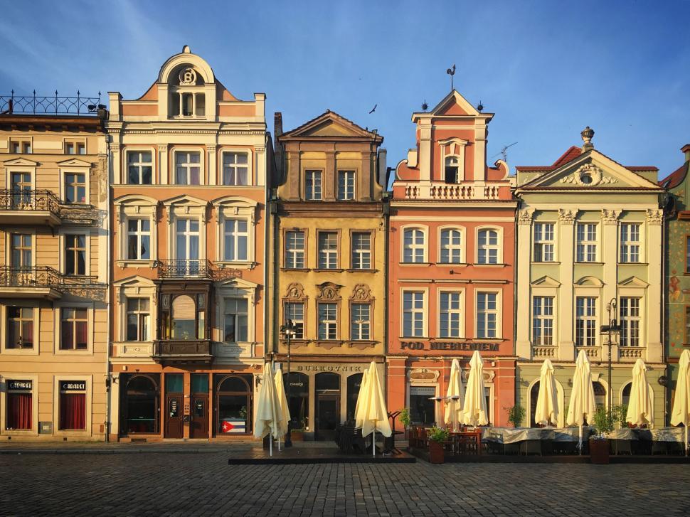 Free Image of Colorful historical buildings on a European square. 