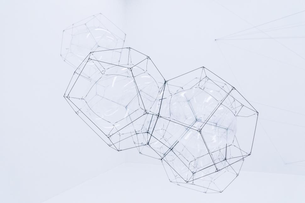 Free Image of Abstract geometric wireframe structure in white space 