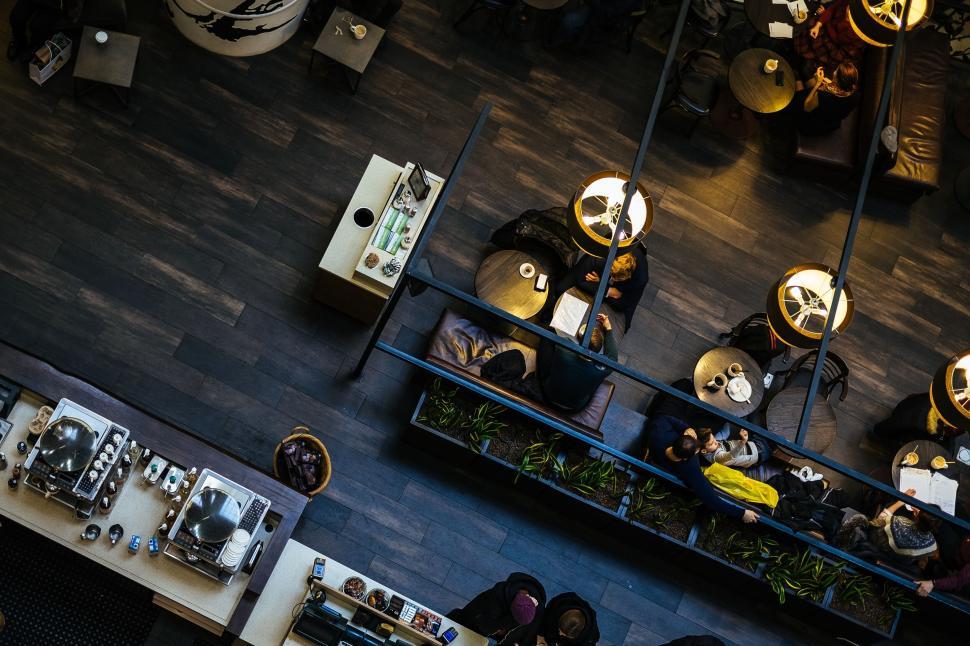 Free Image of Cozy restaurant with people enjoying their meals 