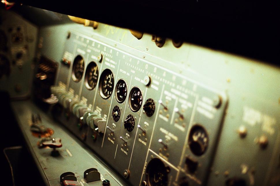 Free Image of Cockpit view with detailed control panel and gauges. 