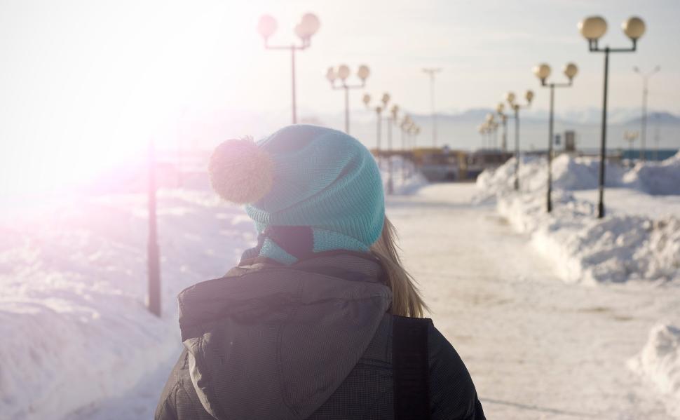 Free Image of Person in winter clothes walking in a snowy landscape 