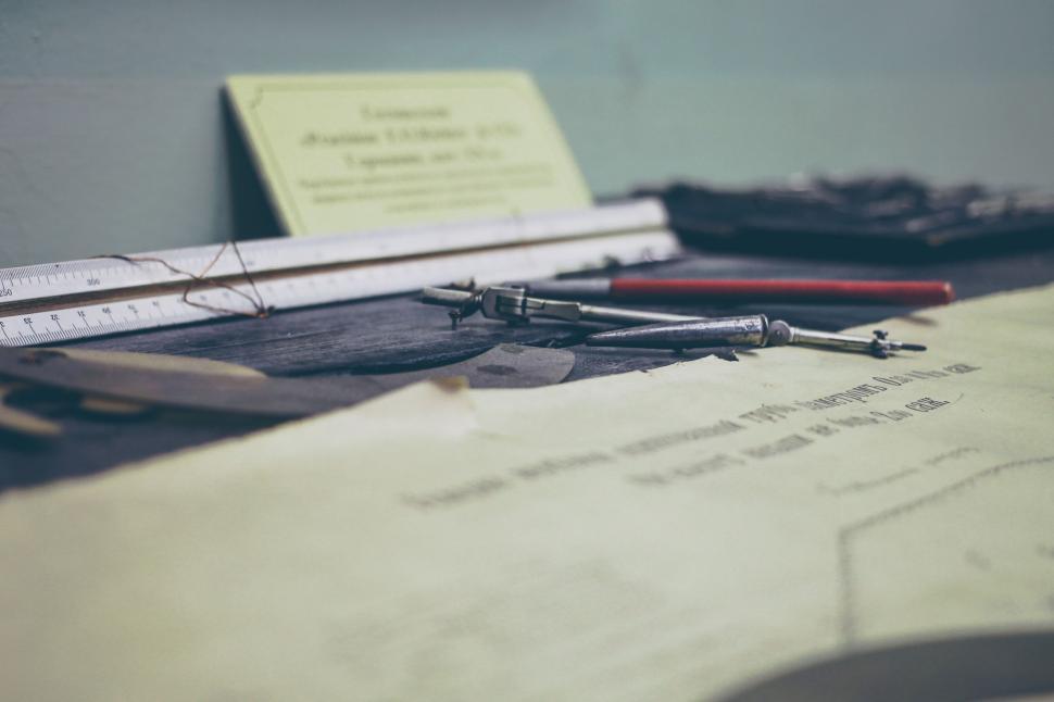 Free Image of Engineer tools and architectural plans on a table 