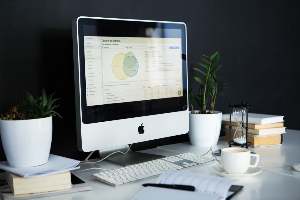 Free Image of Productive office setup with Apple computer screen 
