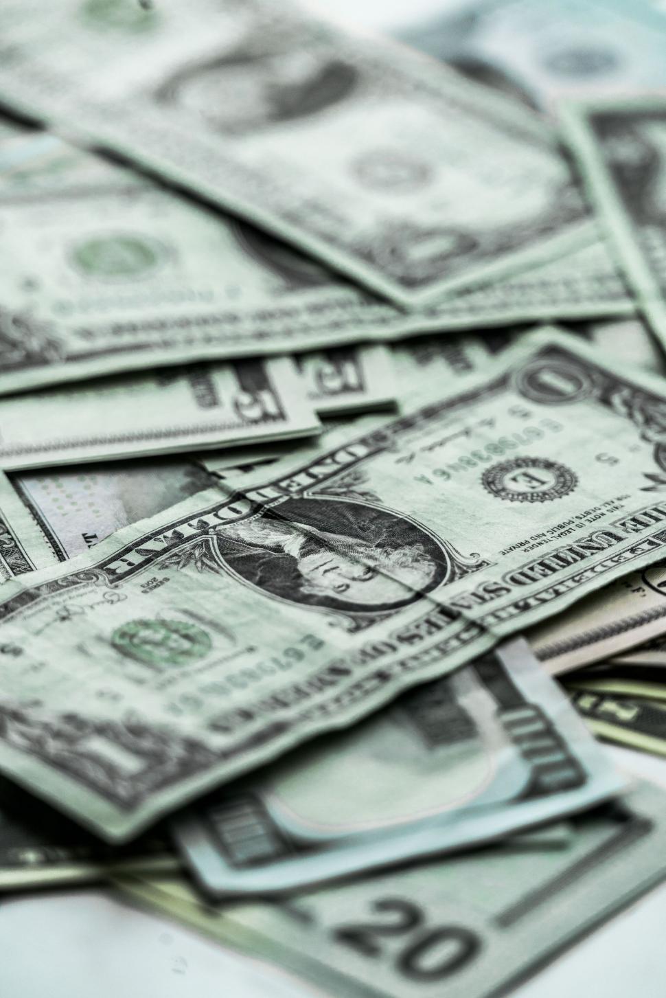 Free Image of Stack of US dollar bills in various denominations close-up. 