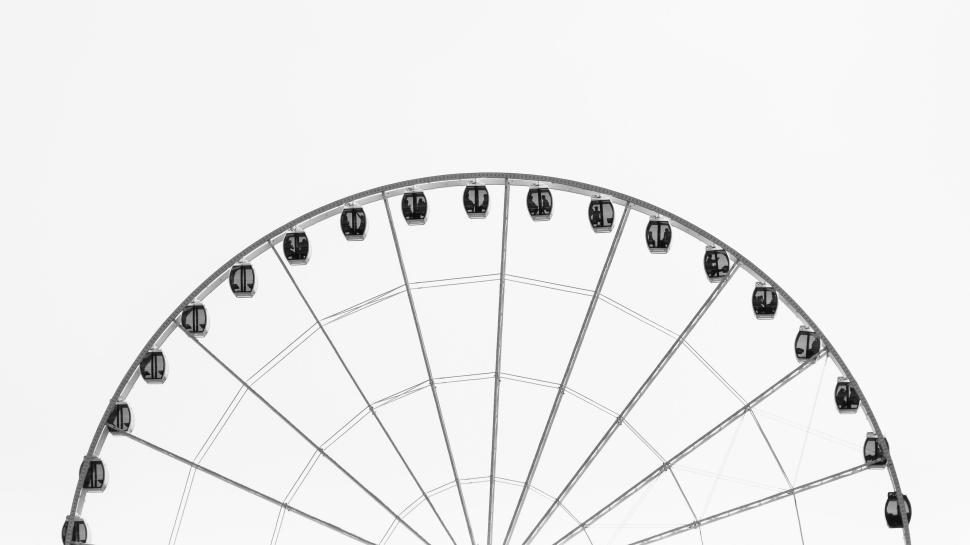 Free Image of Ferris wheel with cabins against a clear white background 