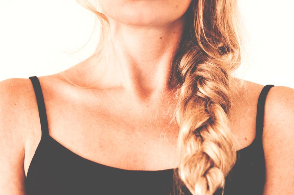 Free Image of Close-up of woman with braided hair in black top 