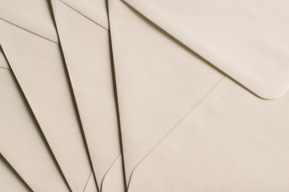 Free Image of Stack of neutral-colored envelopes in a fanned layout 