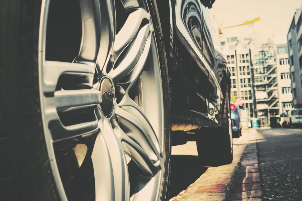 Free Image of Close-up of car wheel on urban street, modern city life. 