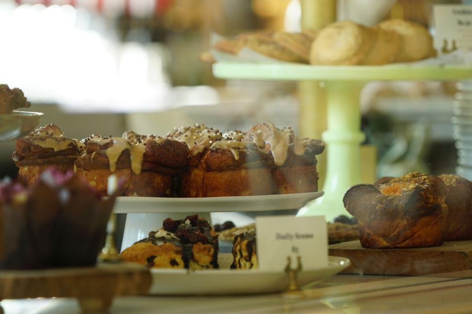 Free Image of Various pastries displayed on multi-tiered trays. 