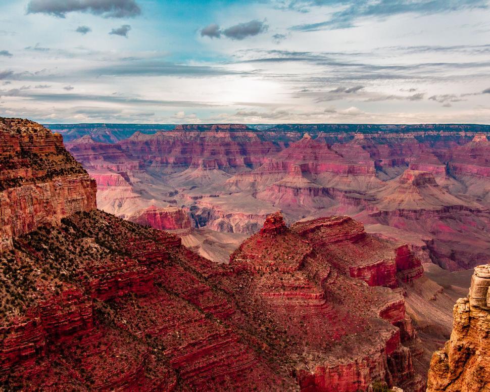 Free Image of A stunning view of the Grand Canyon under a vast sky. 