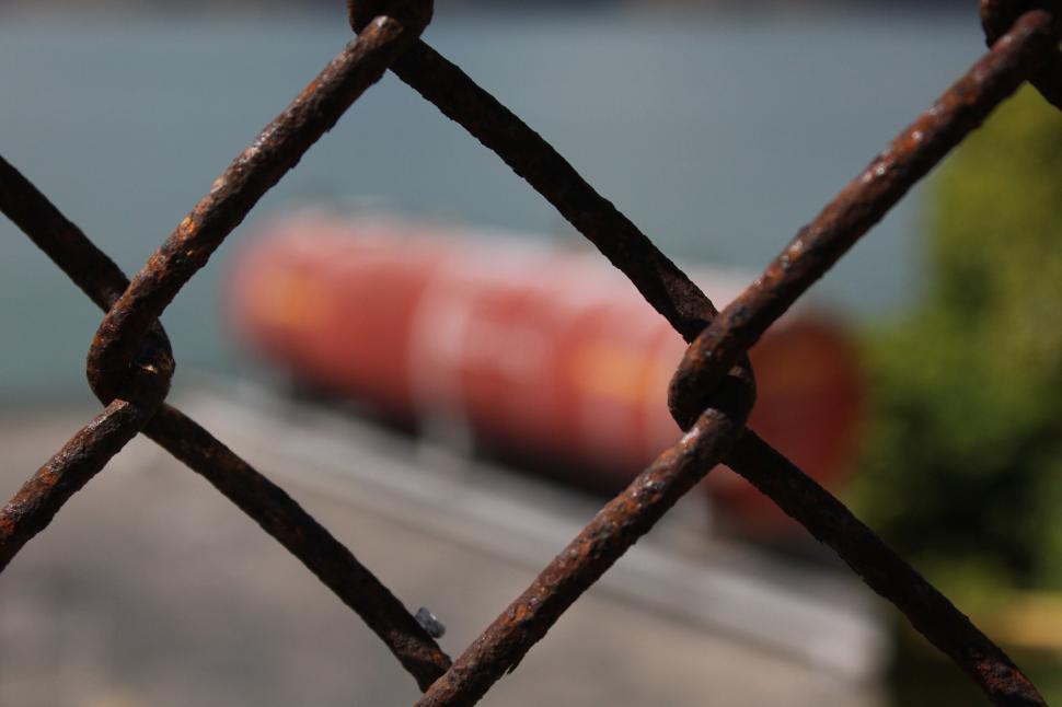 Free Image of Rusty chain-link fence close-up with blurred background. 