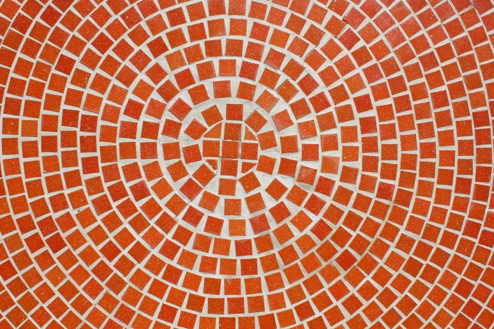 Free Image of Red mosaic pattern forming a circular, artistic design. 