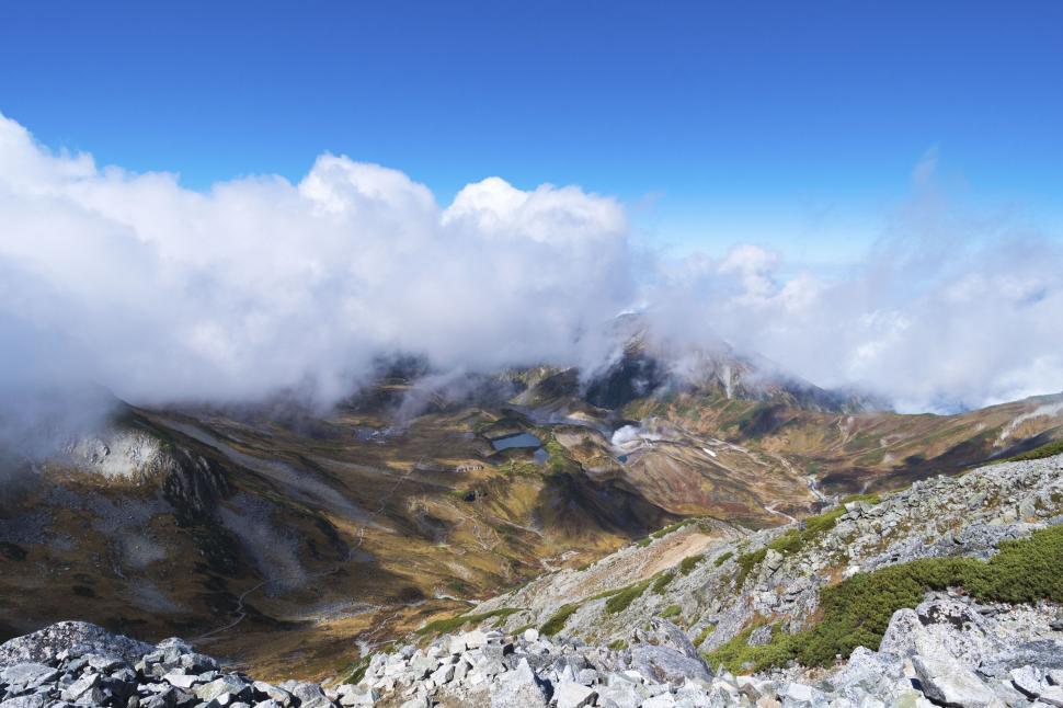 Free Image of Majestic mountain view among the clouds with clear sky 