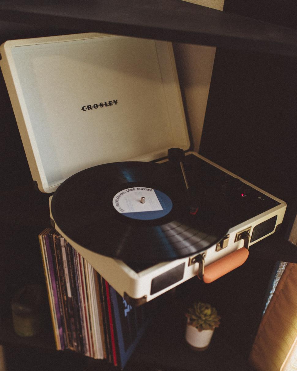 Free Image of Crosley record player with a vinyl record playing 