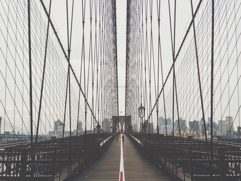 Free Image of Suspension bridge with cables leading into the horizon 