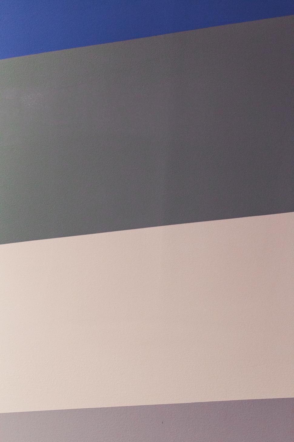 Free Image of Stripes of different shades of blue and grey on wall. 
