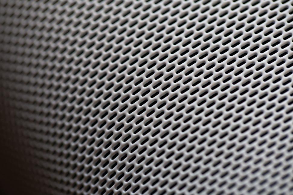 Free Image of Close-up of perforated surface with teardrop-shaped holes 
