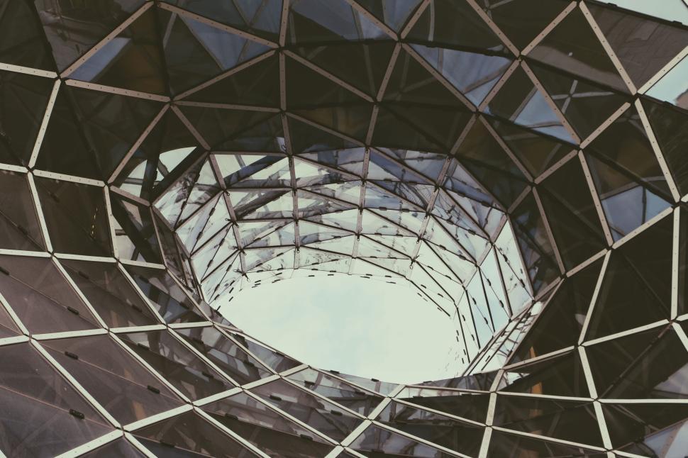 Free Image of Futuristic geometric glass structure with open roof 