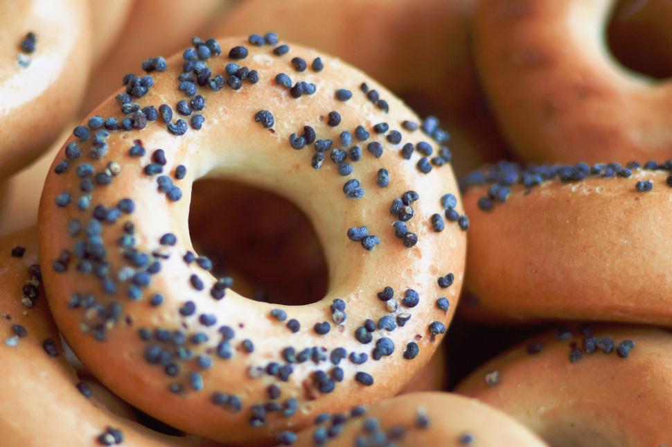 Free Image of Close-up of bagel with black poppy seeds on top surface 