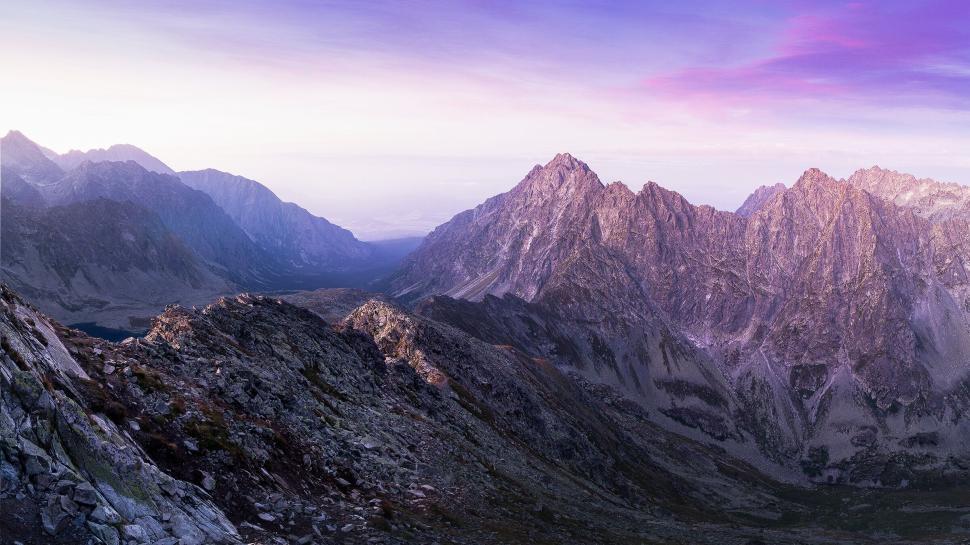 Free Image of Panoramic view of mountain range during early sunset time. 