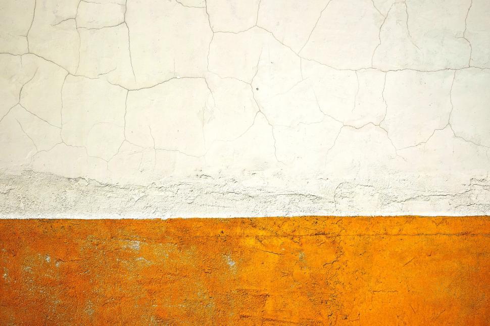 Free Image of Textured exterior wall with a white and orange contrast. 