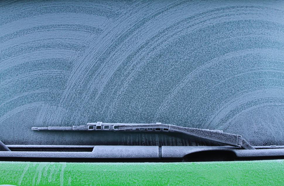 Free Image of Frosty windshield surface with visible wiper pattern. 