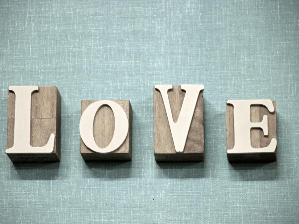 Free Image of ‘LOVE’ wooden blocks decor on fabric background, sentiment 