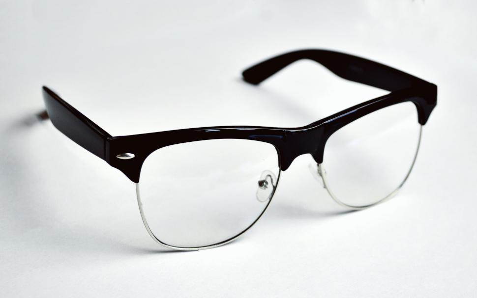 Free Image of Black-framed eyeglasses with clean minimalist design. 