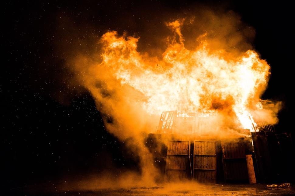 Free Image of Wooden structure ablaze in intense, bright flames 